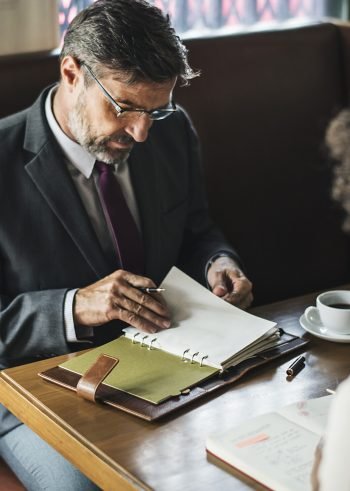 Business people discussing in the cafe